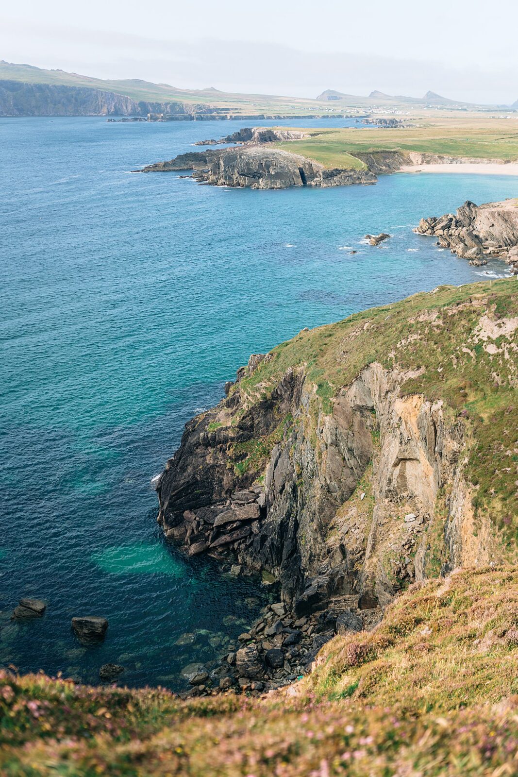 Sweeping landscape photo of the cliffs at Ceann Sibeal, exclusive sneak peek from an Irish travel journal.